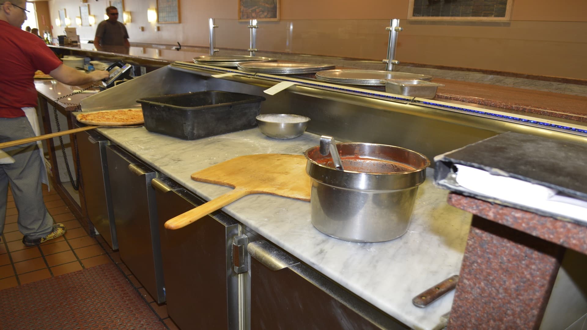 Pizza preparation at Rose's Pizza