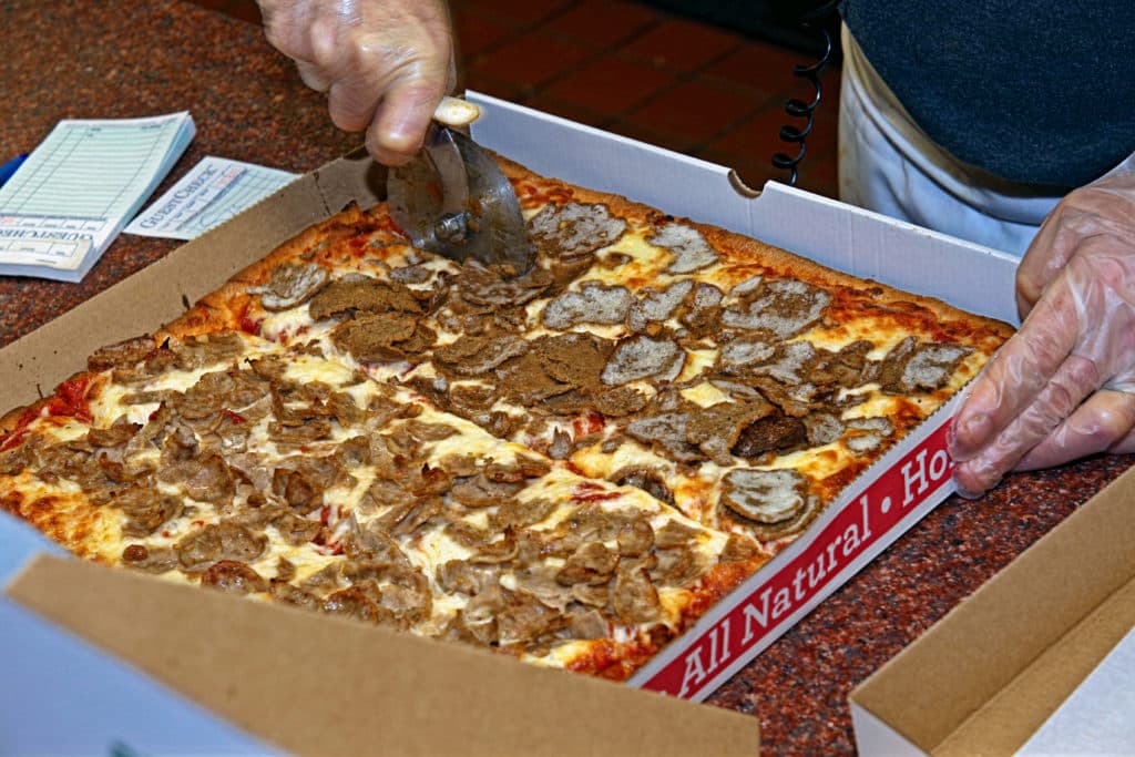 Fresh out of the oven Sicilian pizza with sausage